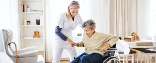 caregiver helping senior woman